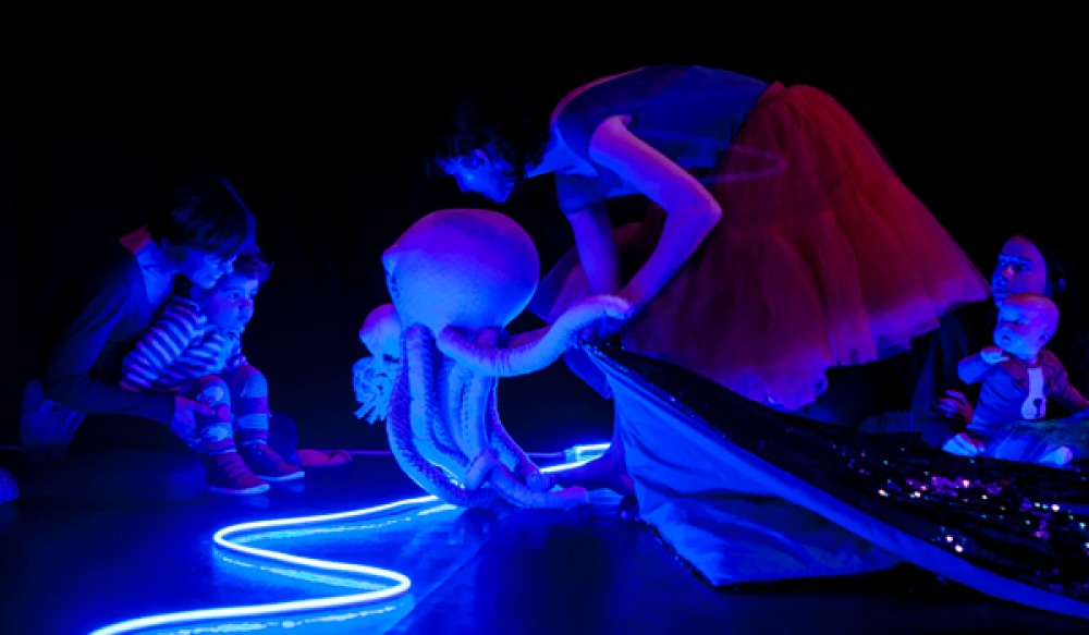women with babies enjoying a sensory under the sea show