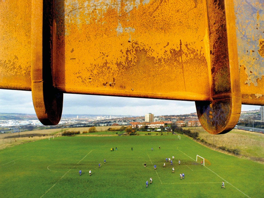 Wing over the angel looking over a football pitch