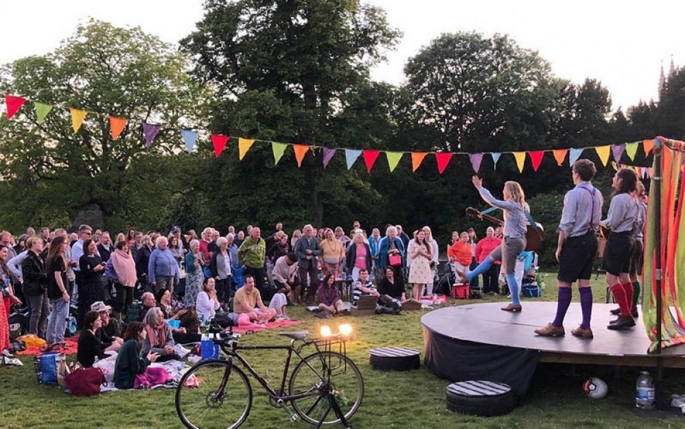 performers on an open air stage