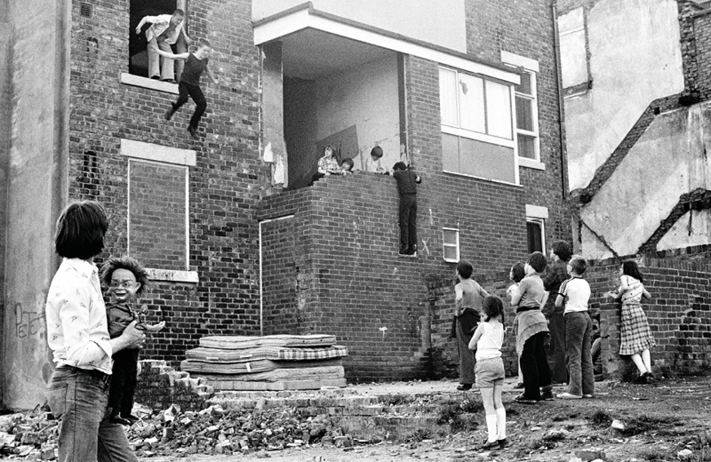 Kids Jumping On To Mattresses - Youth Unemployment (1981) Tish Murtha (c) Ella Murtha