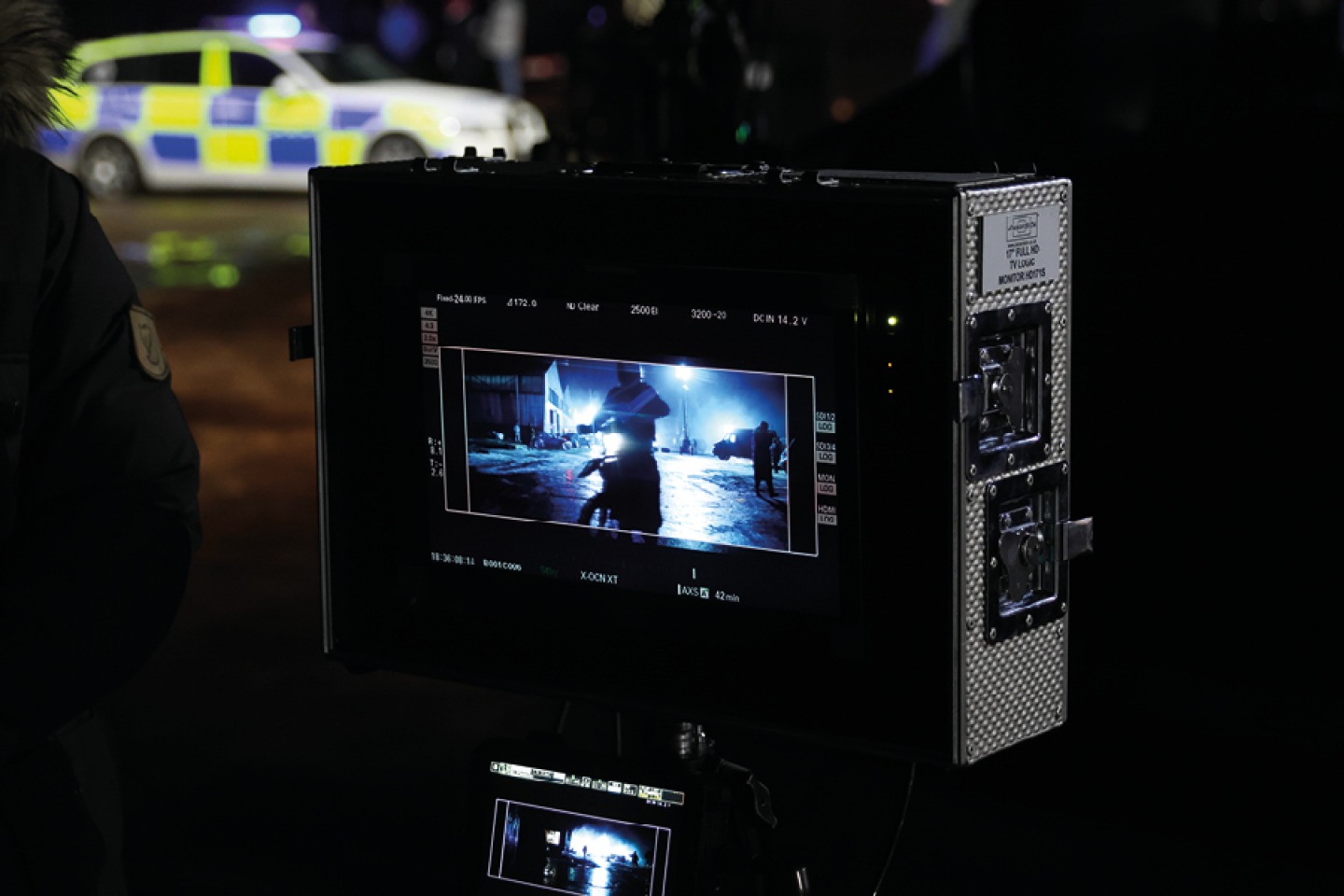 Police car on scene looking through black camera © Nathan Lewis
