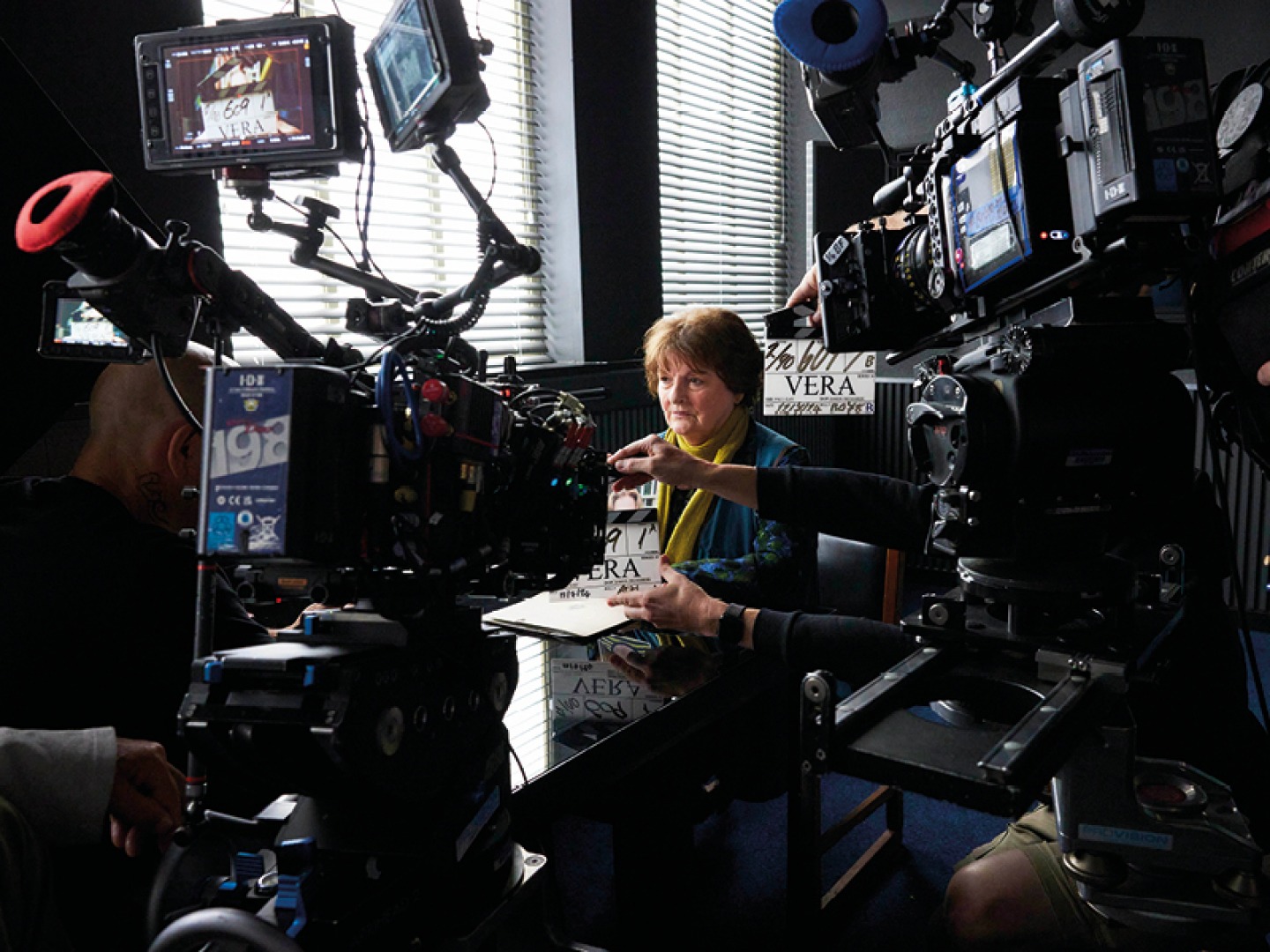 Filming shot, vera surrounded by cameras