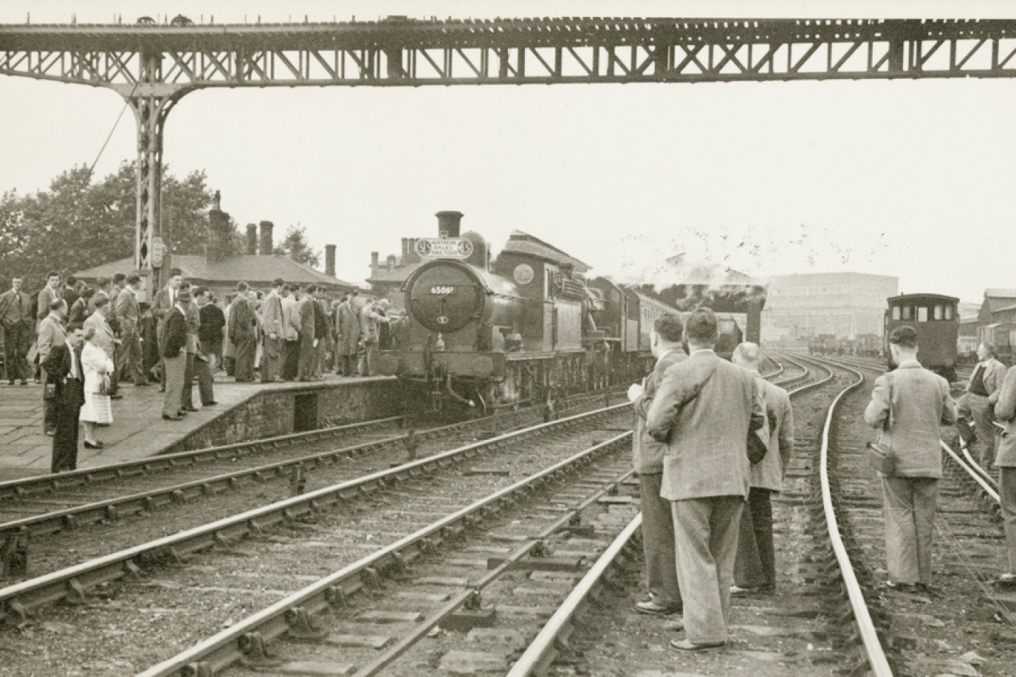 Crowds gathered at North Road Station to see a steam train about to embark on the Northern Dales Rail Tour, Darlington, 1955. © Historic England Archive