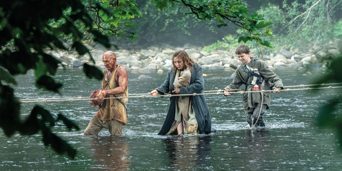 characters crossing water in a scene from 28 years laters