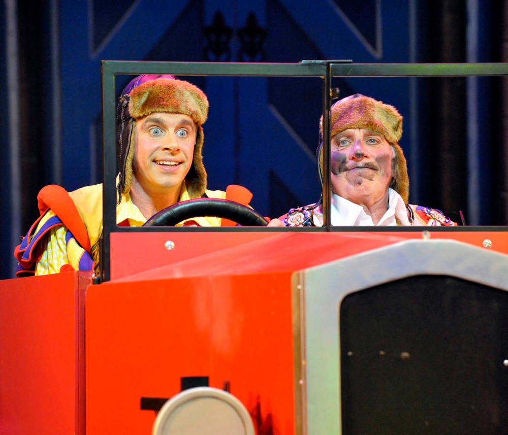 Danny and Clive on stage in a model car