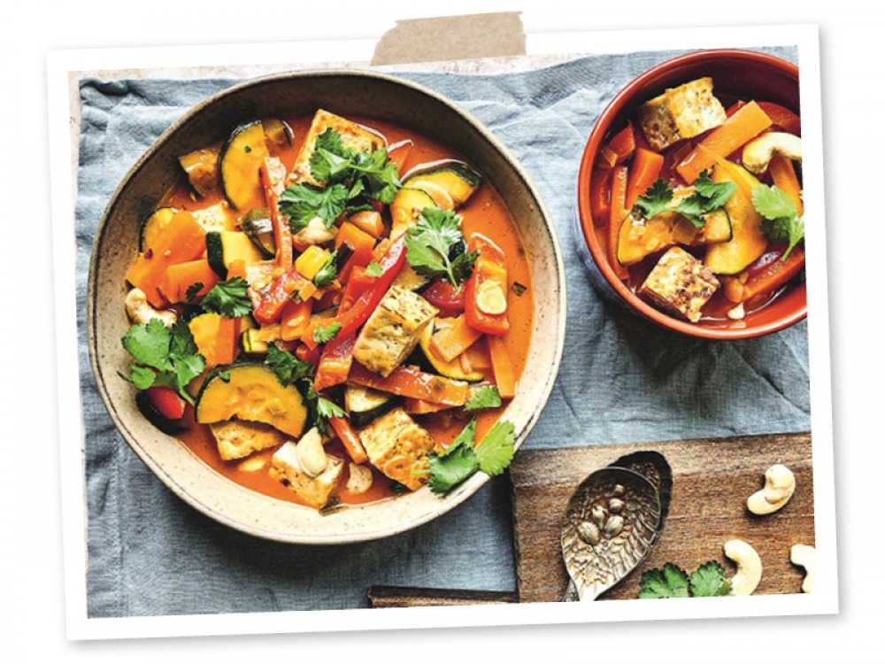 Bowl of gochujang veggies with crispy tofu and cashews