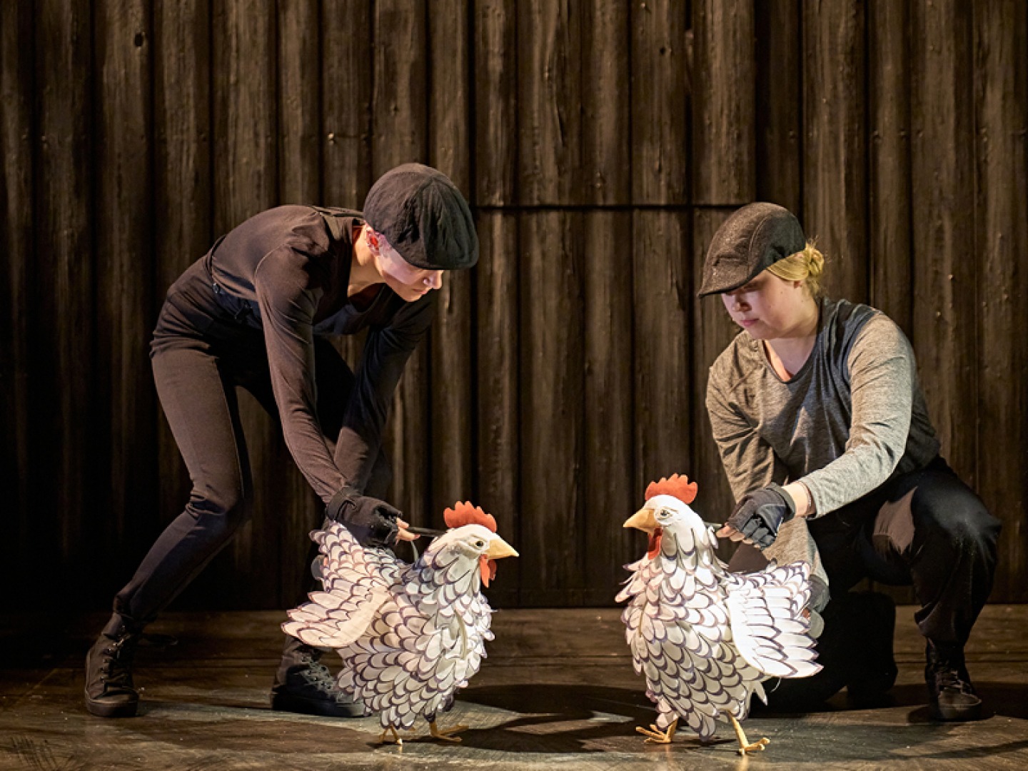 Hens (puppeteers Edie Edmundson and Darcy Collins) in Animal Farm