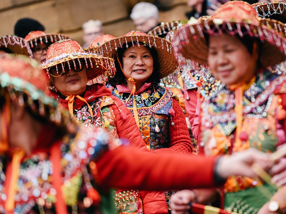 Ladies in traditional Chinese dress celebrating Lunar New Year