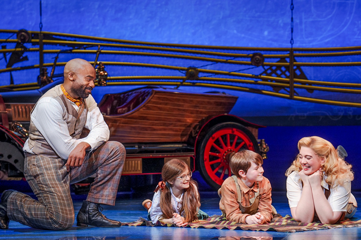 Caractacus, Jeremy, Jemima and Truly at a beach scene with Chitty Chitty Bang Bang