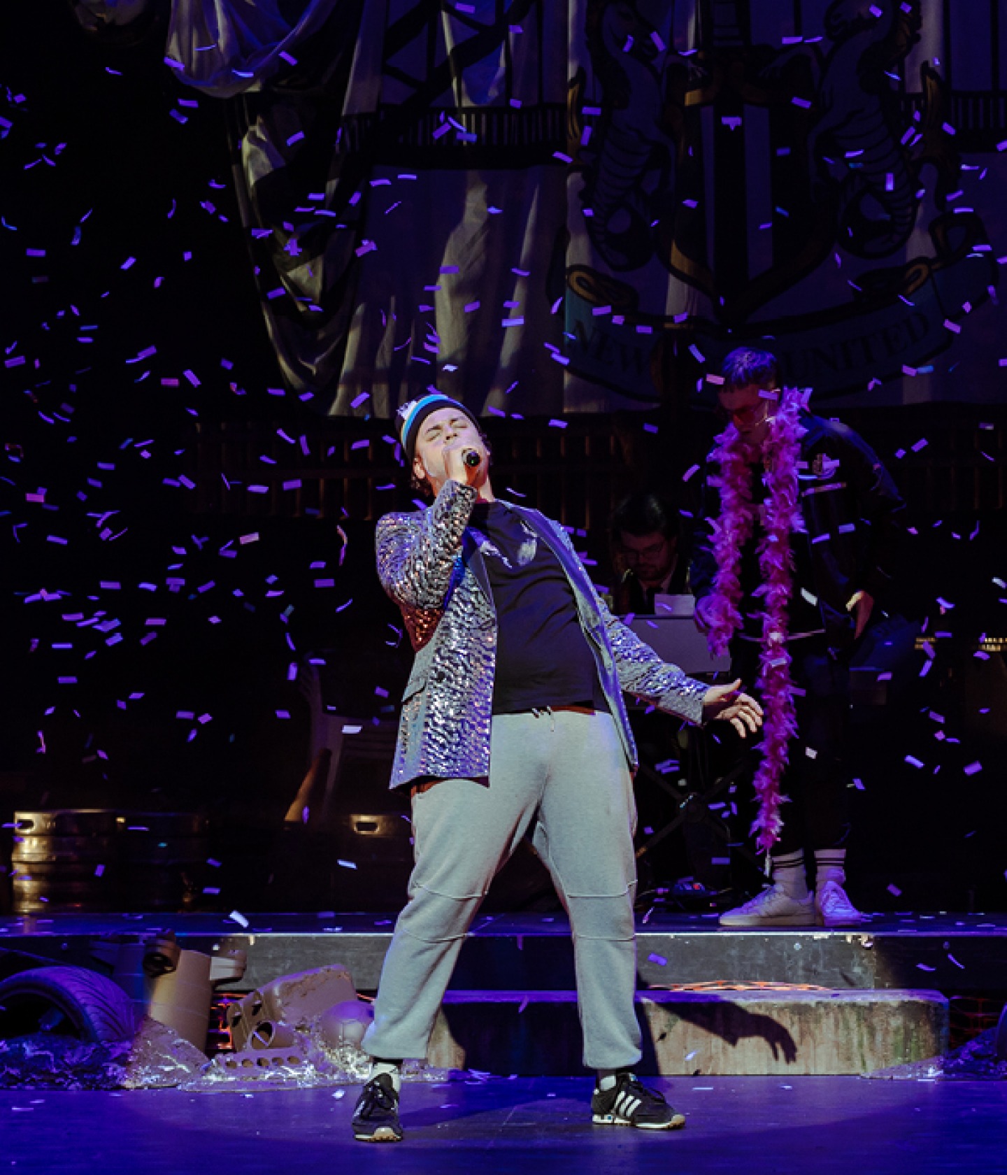 sewell singing with falling confetti wearing sparkling jacket