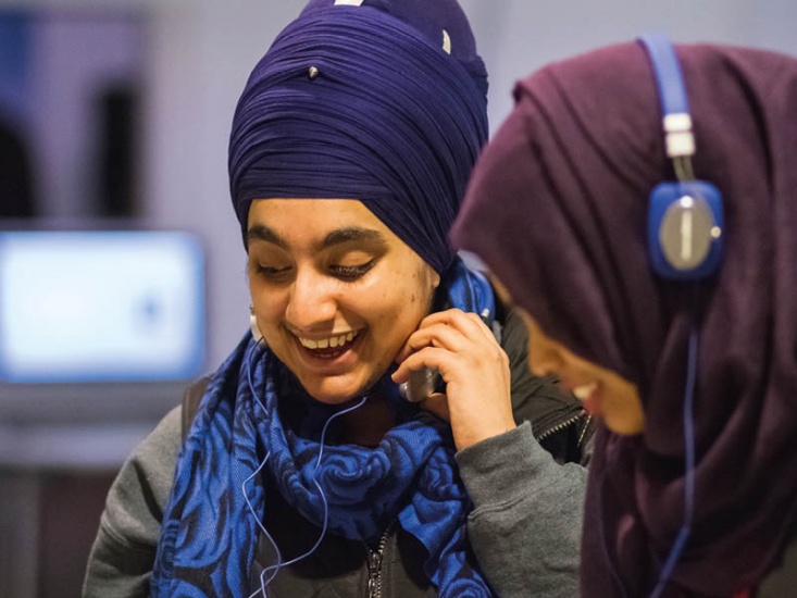 girls laughing with headphones