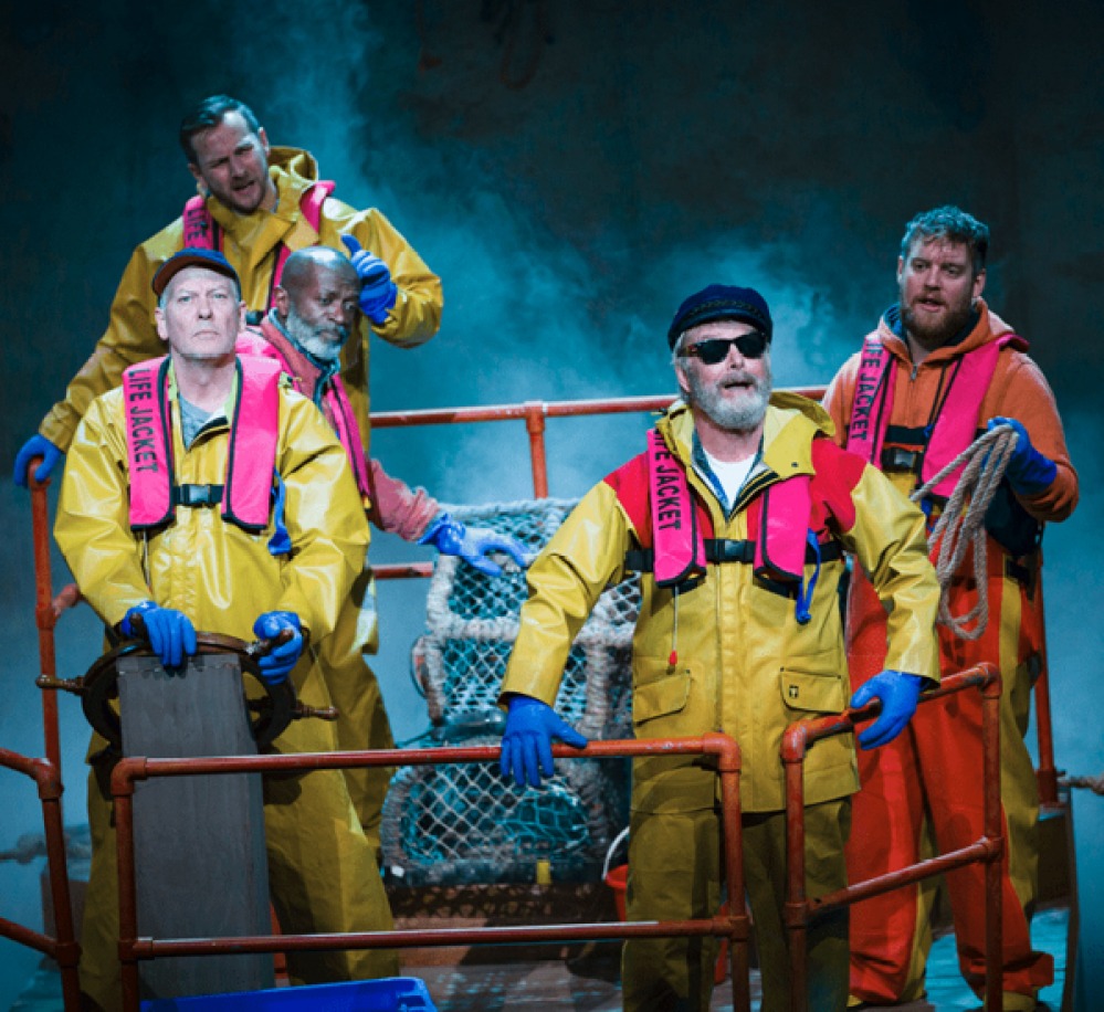 actors on stage dressed and fishermen