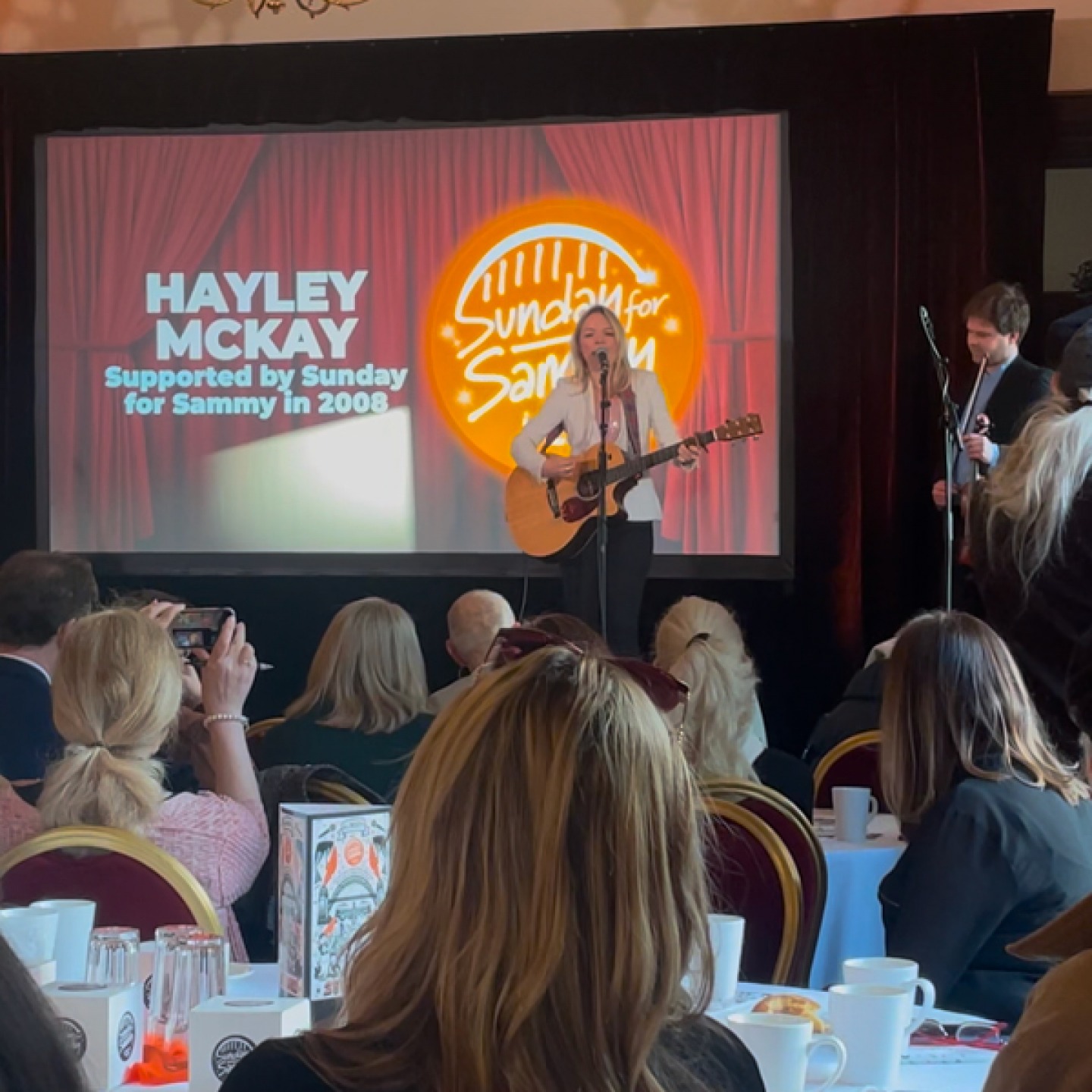 Hayley McKay on stage singing