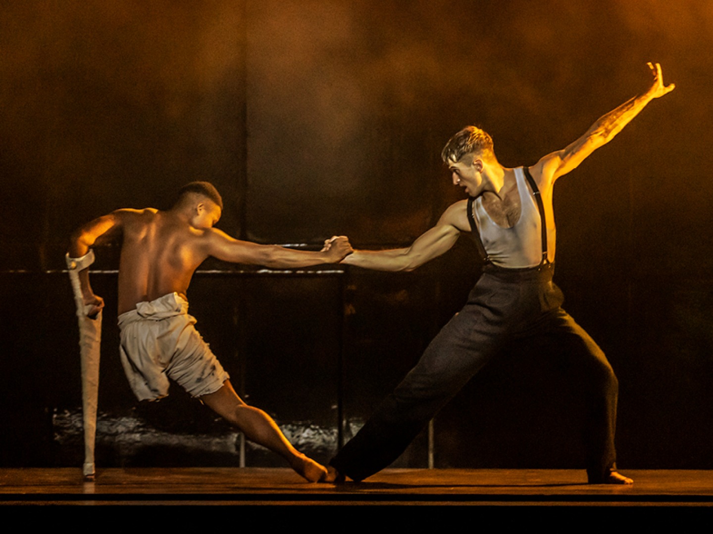 Barney (Musa Motha) and Tommy (Guillaume Quéau) dancing on stage