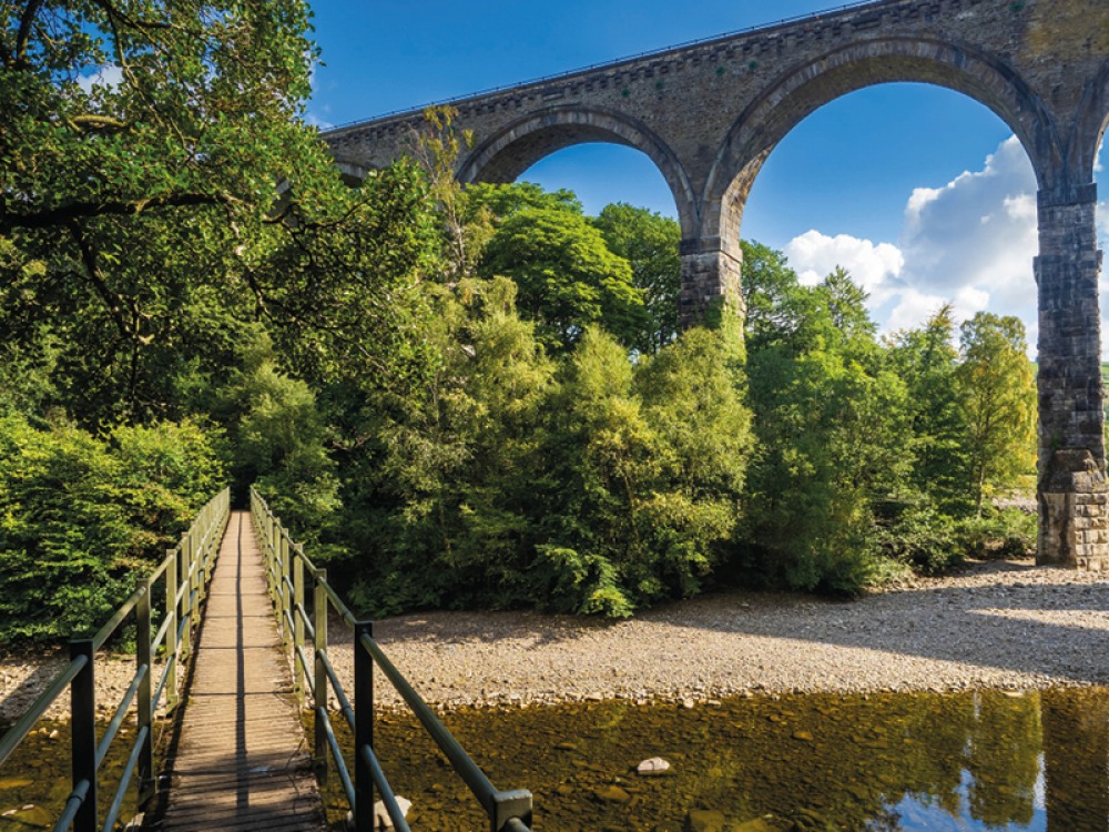 Viaduct over river with a foot bridge