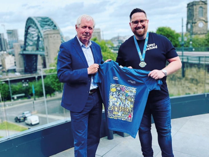 James Dixon holding his designs for GNR 2022