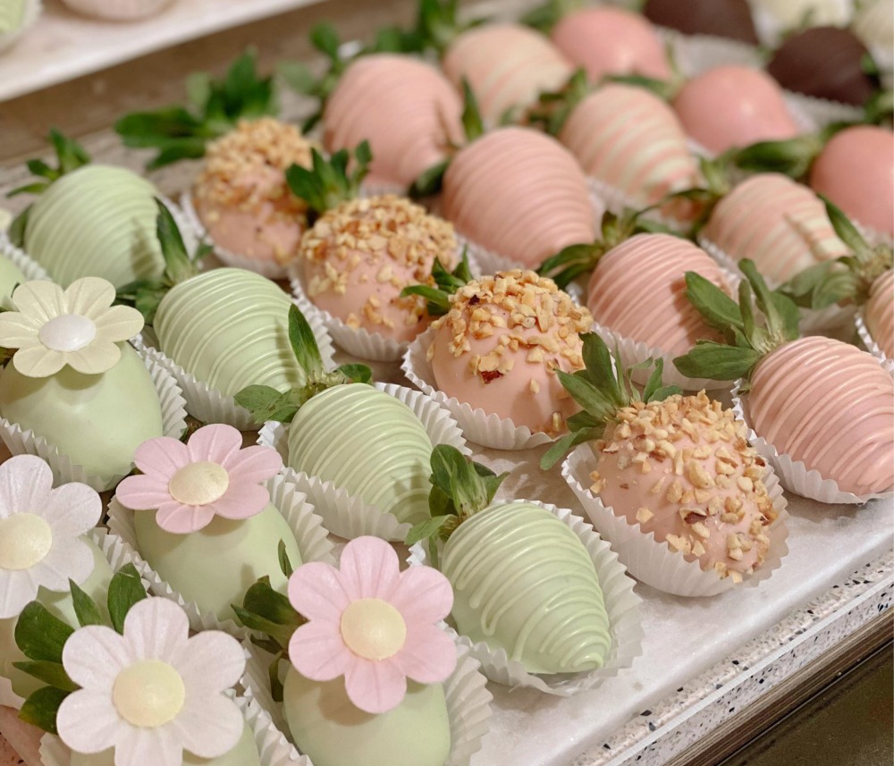 Fruit decorated and coated in pastel coloured chocolate