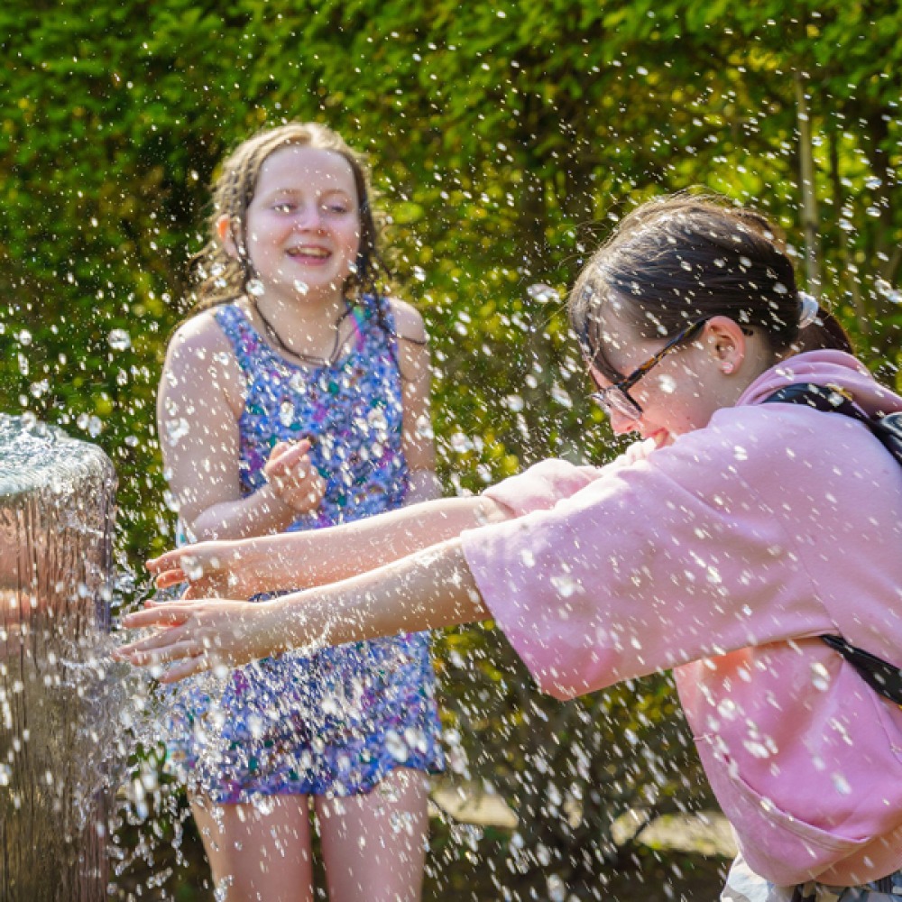 Girls playing in a water feature at The Alnwick Garden