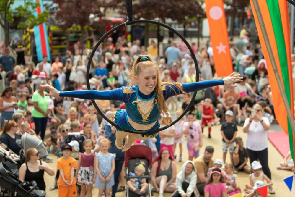 Performer doing street acrobatics