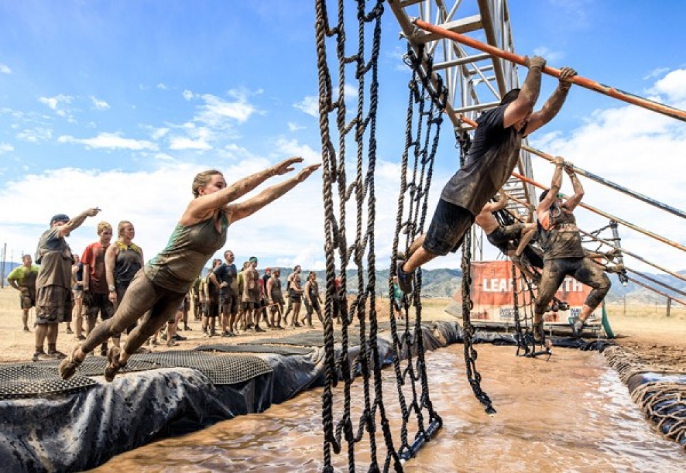 People competing in Tough Mudder