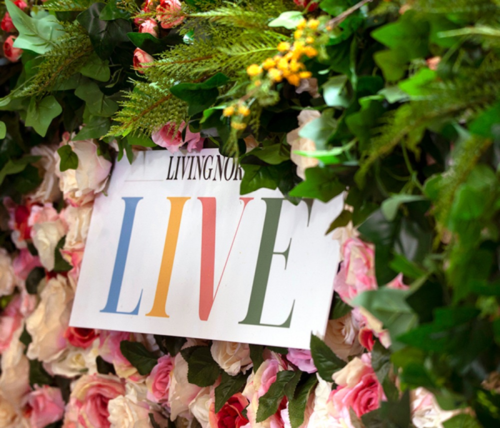 Living North LIVE signage surrounded by folio