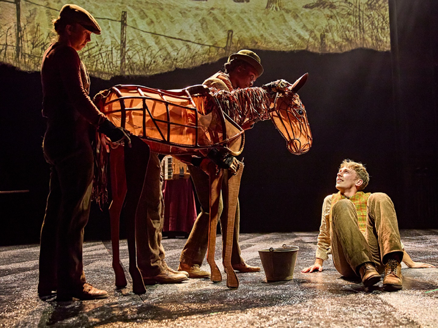 Tom Sturgess (Albert Narracott) and Diany Samba-Bandza, Jordan Paris, Eloise Beaumont-Wood (Baby Joey) in War Horse.