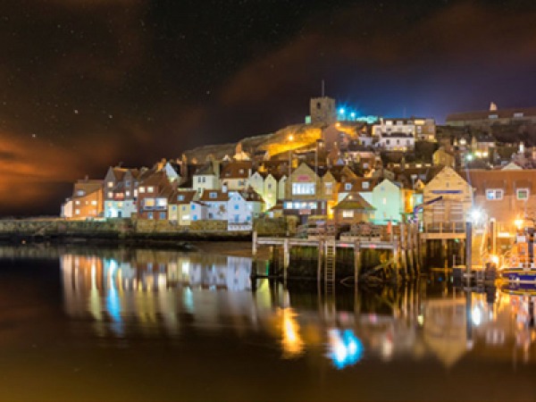 night time photo of a harbour and lights