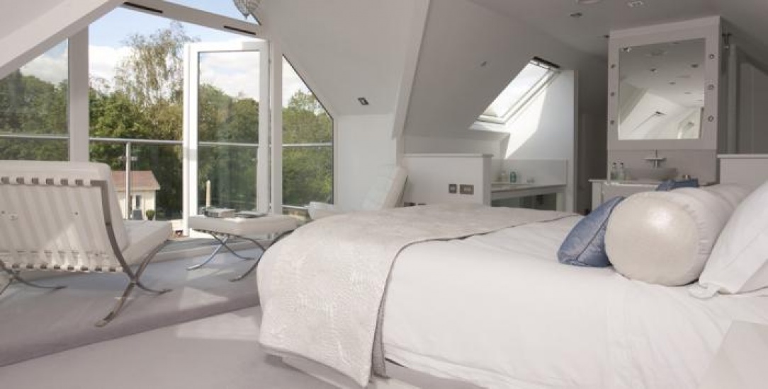 White bed in a country house