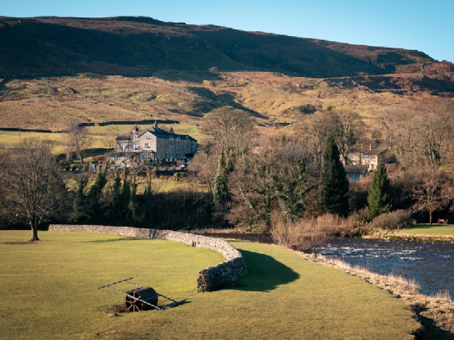 Hotel next to river and mountains