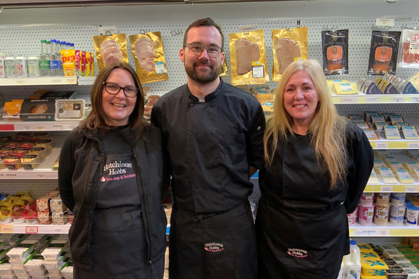 Kitchen Staff posing in the shop for a photo