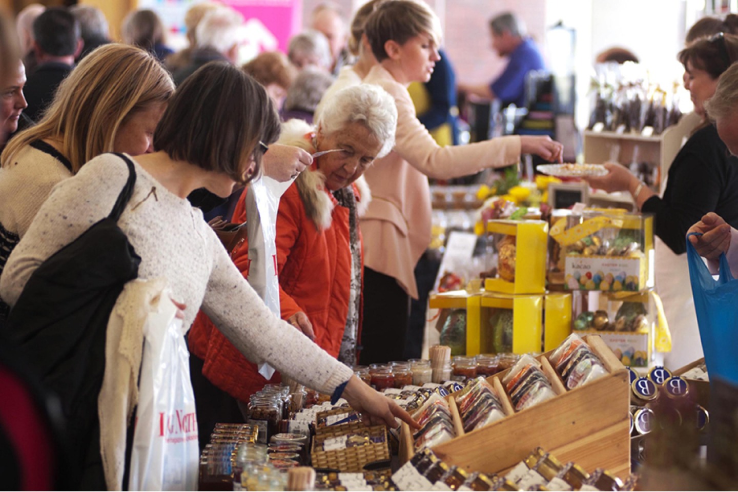 Fair goers browsing through stalls