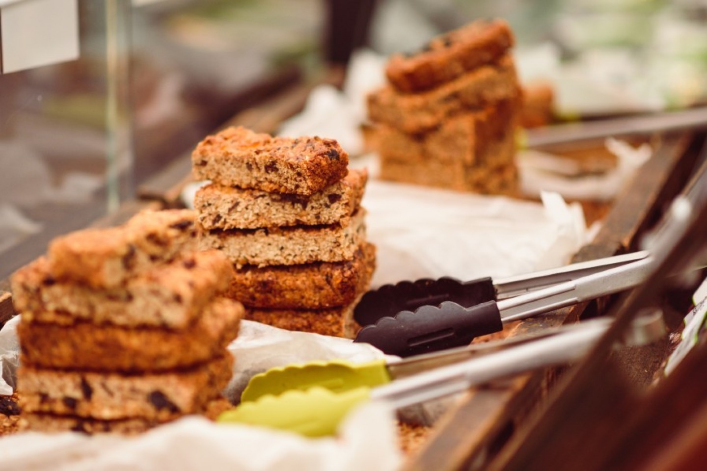 Flap jacks stacked under cover on food stall