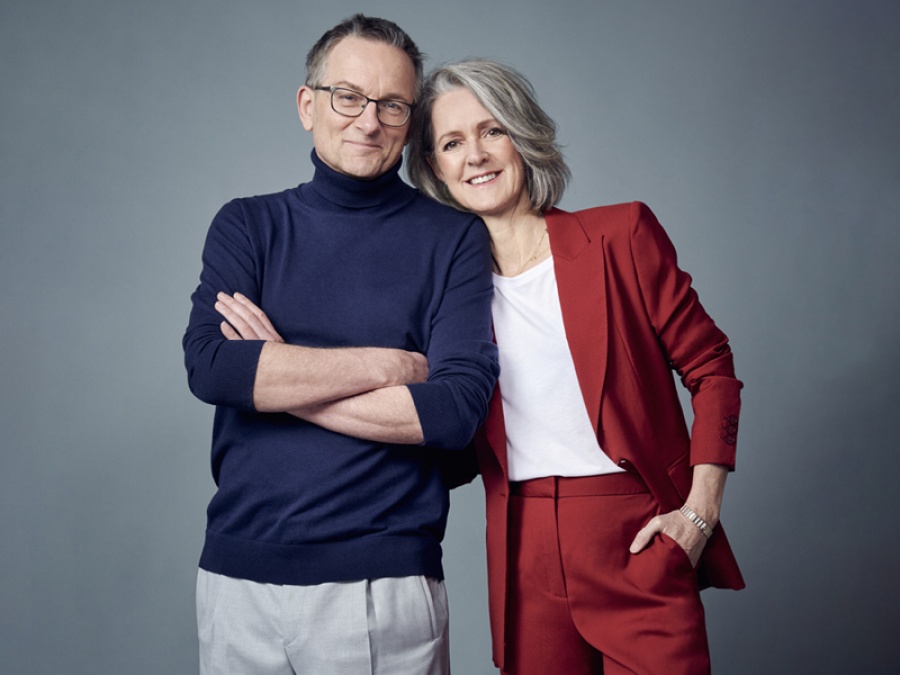man and woman smiling for a promotion image for their theatre tour